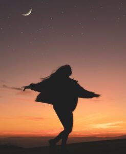 silhouette of woman running during golden hour